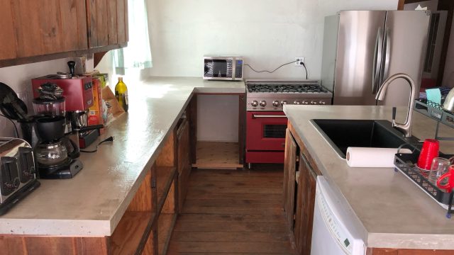 Transform Your Kitchen with Elegant Green Cabinets and Mid-Century Design